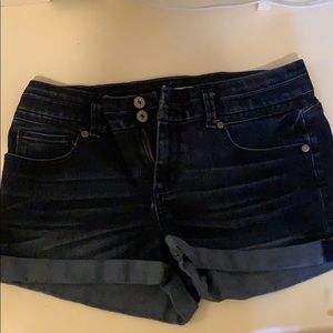 High waisted dark wash denim shorts.